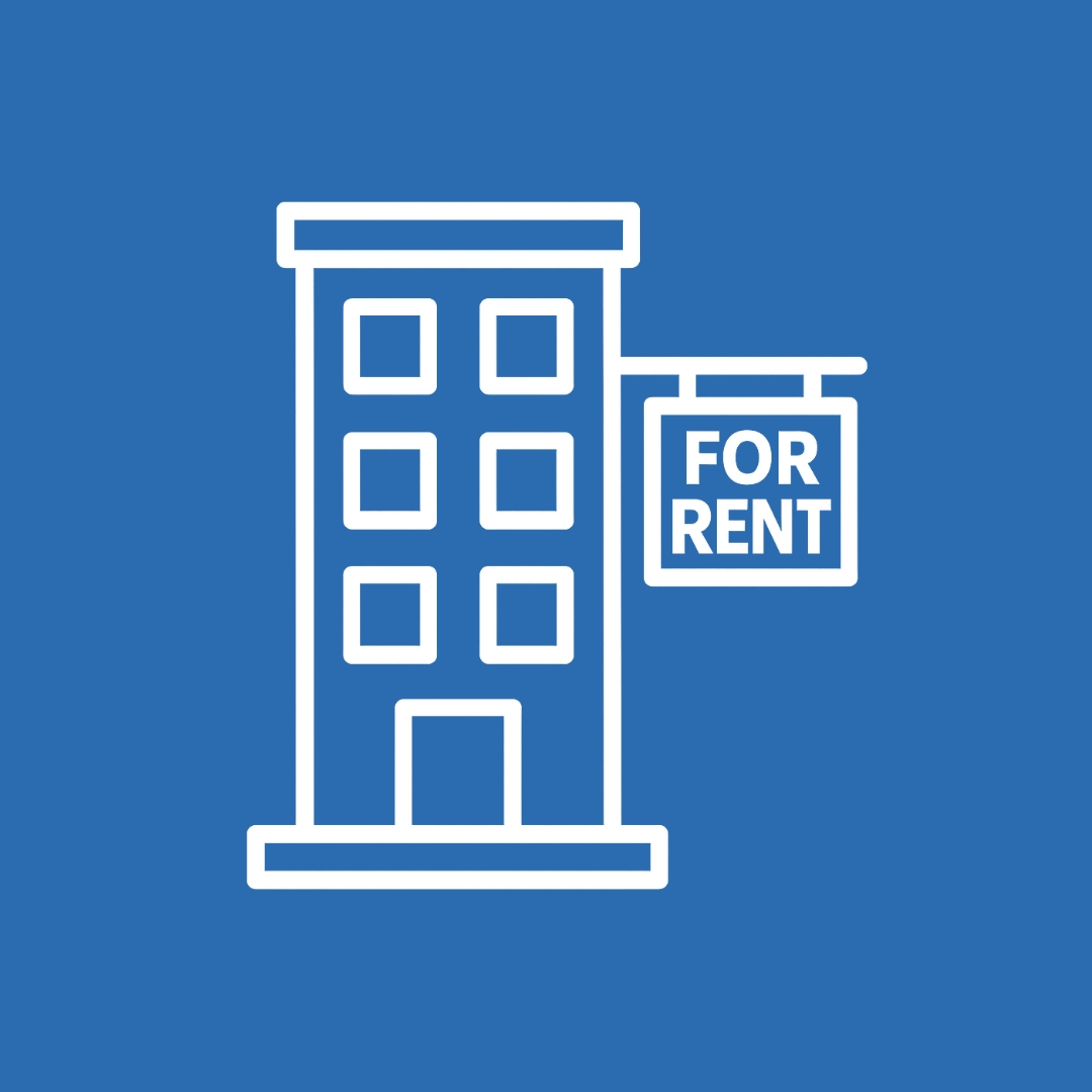 Apartment building with a For Rent sign